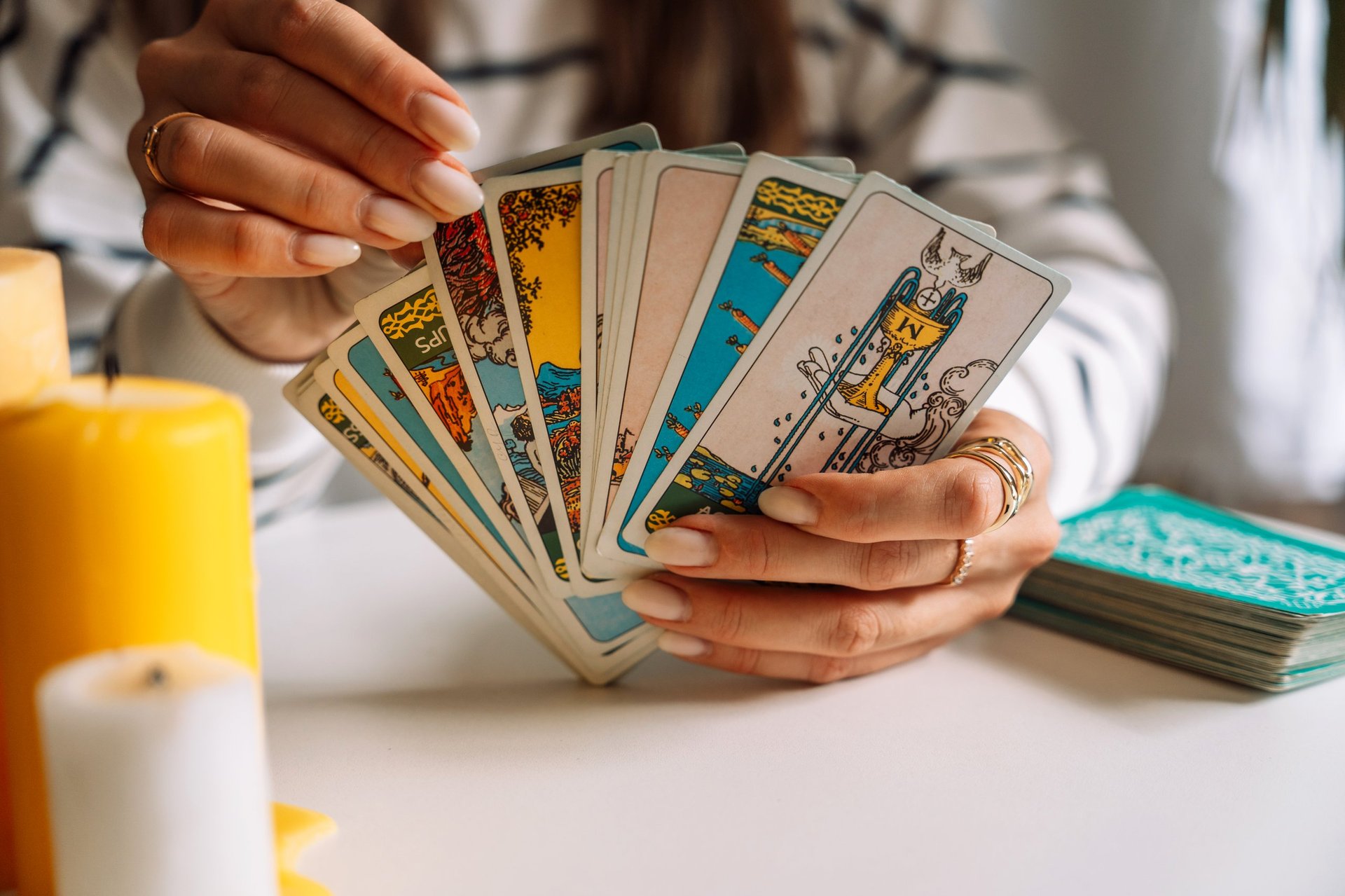 Tarot reader pulling card from deck