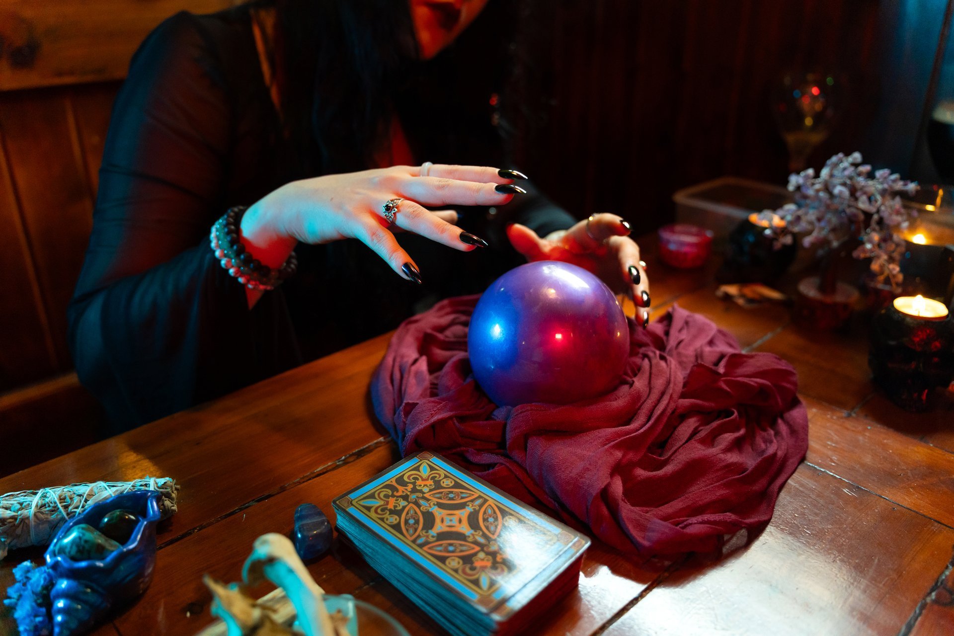Fortune teller using crystal ball and tarot cards